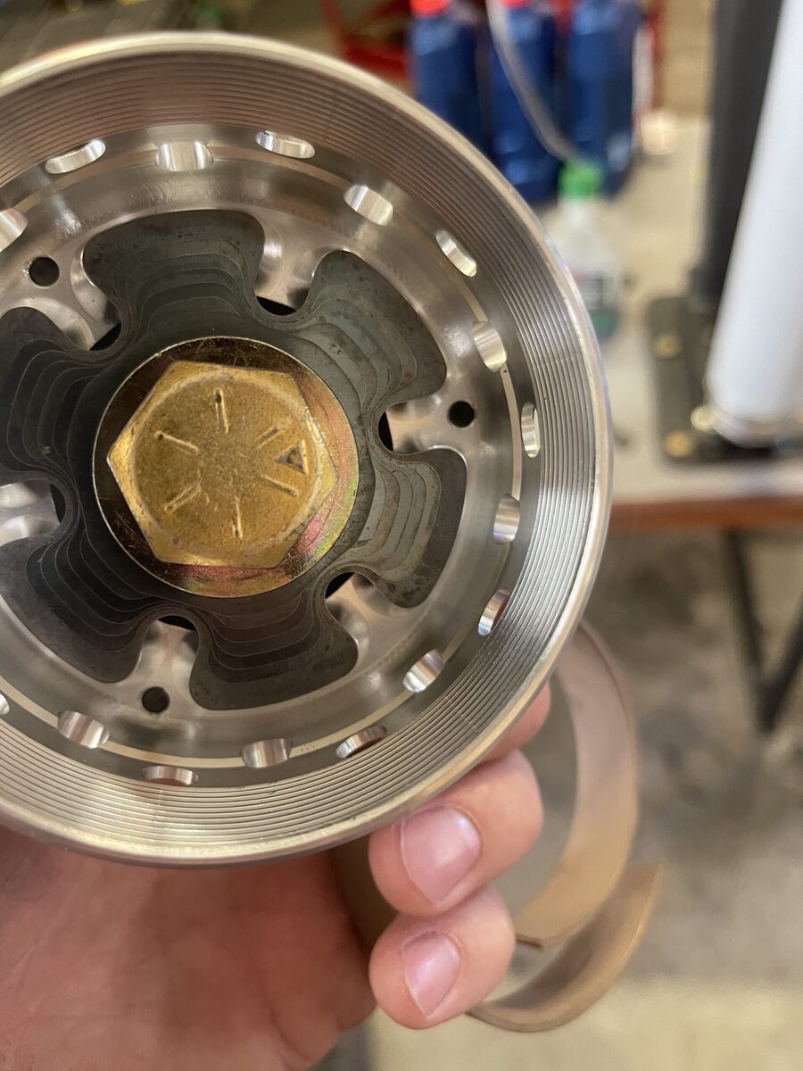 Precision CNC-machined aluminum hub with tight tolerances manufactured on 40x20x20 CNC mill at The High Road Manufacturing
